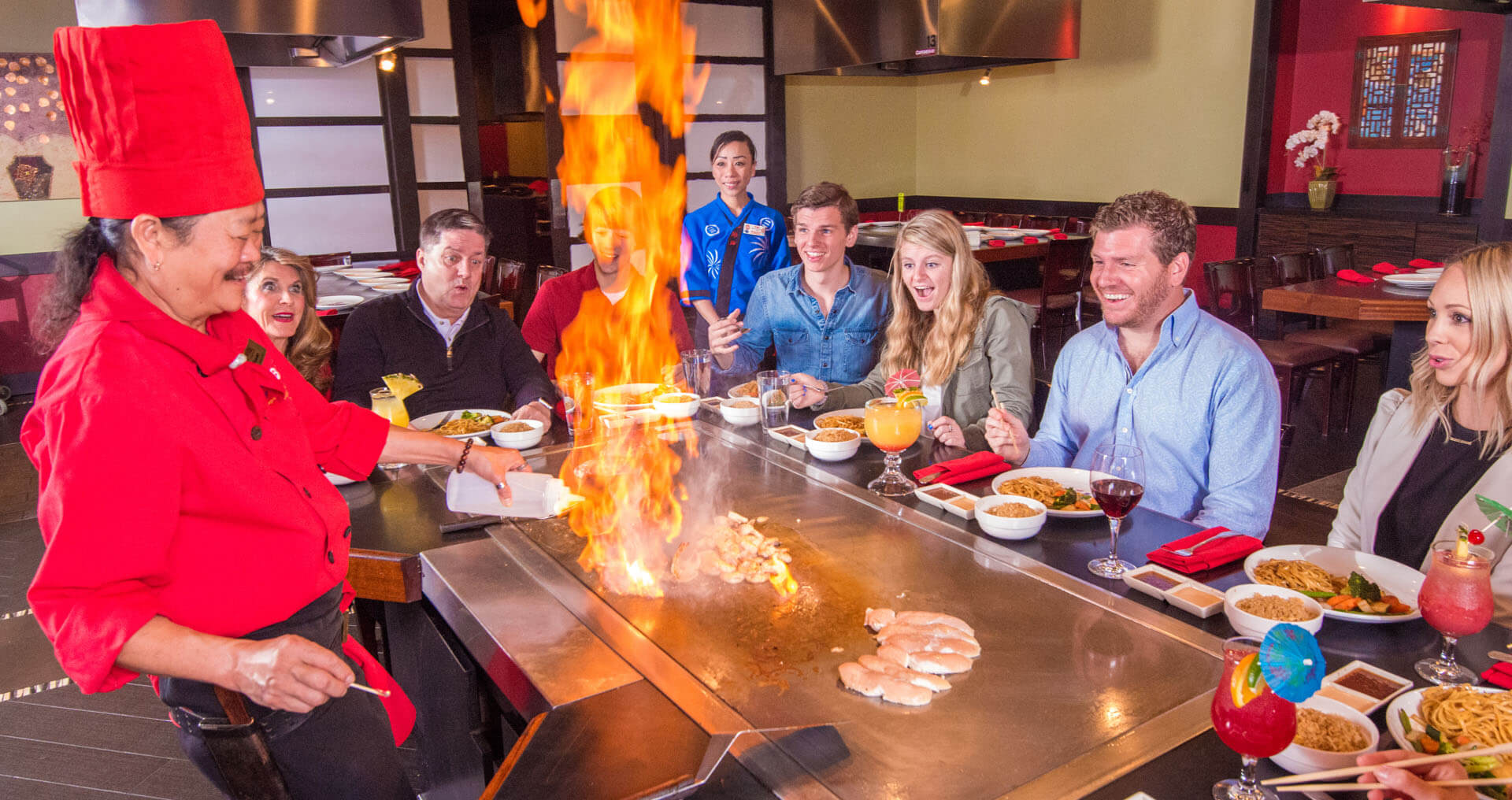 Family enjoying dinner at a restaurant on International Drive.