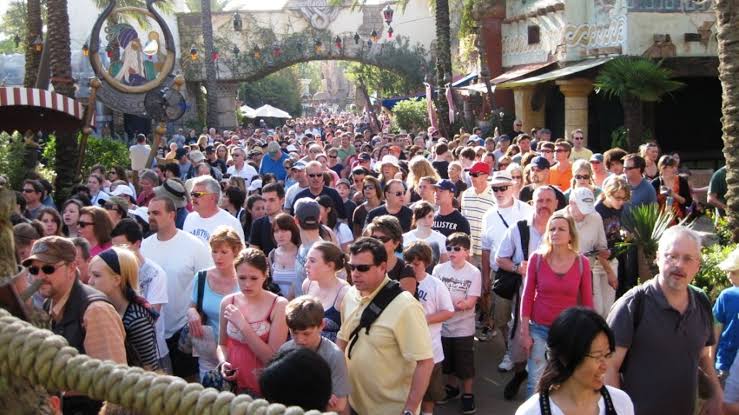 Heavy crowds inside a busy theme park queue